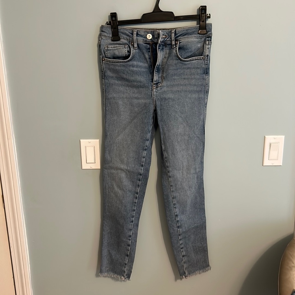 Free People raw edge high-rise jeggings. Has stretch. Size 28.
